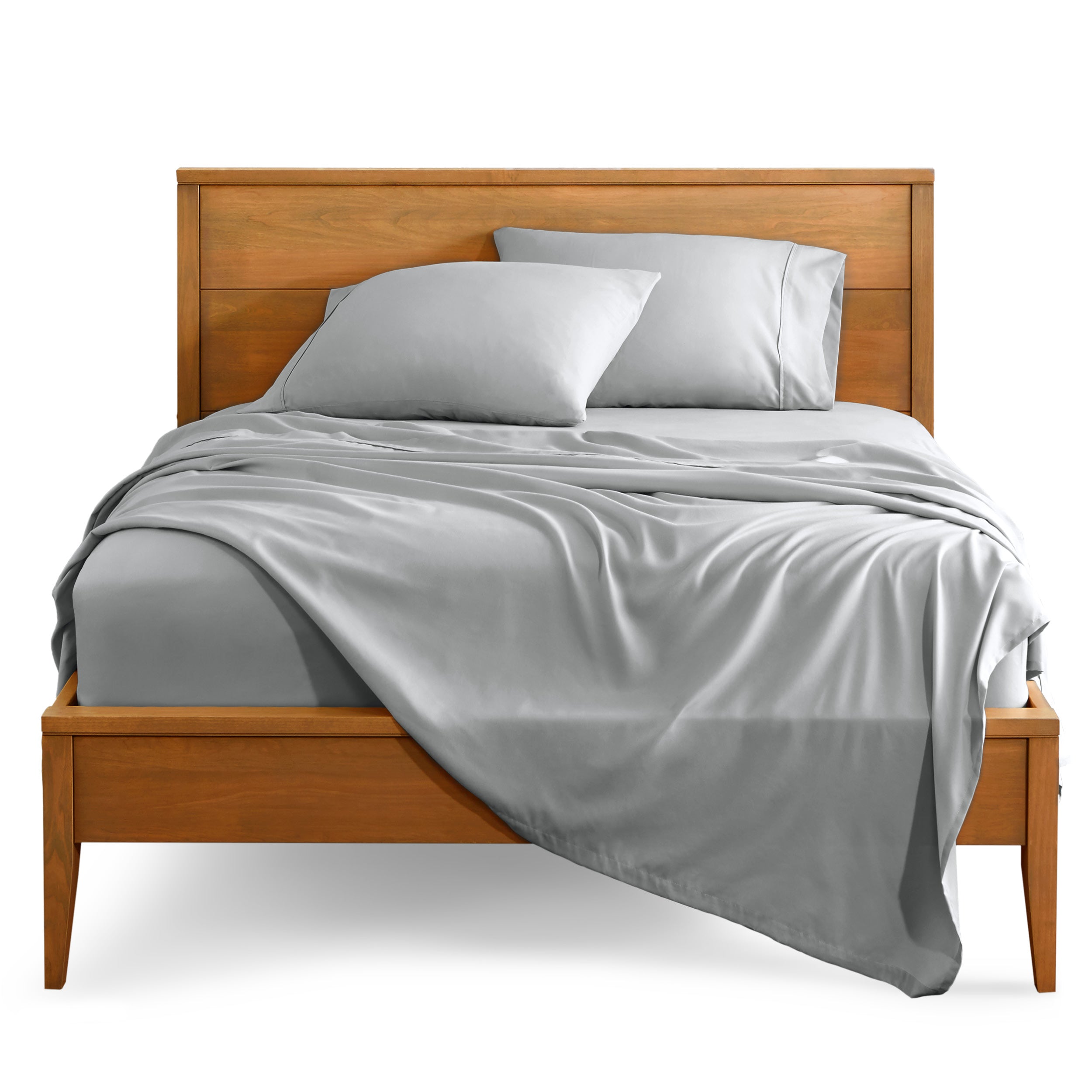 Microfiber sheet set on a bed with a wooden bed frame