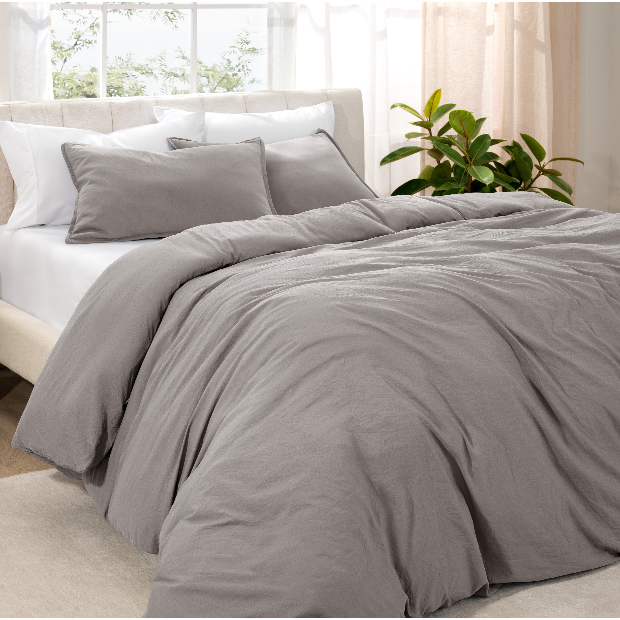 Angled view of bed with a duvet cover folded over on itself