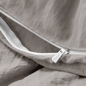 Close up of the zipper on the duvet cover partially opened