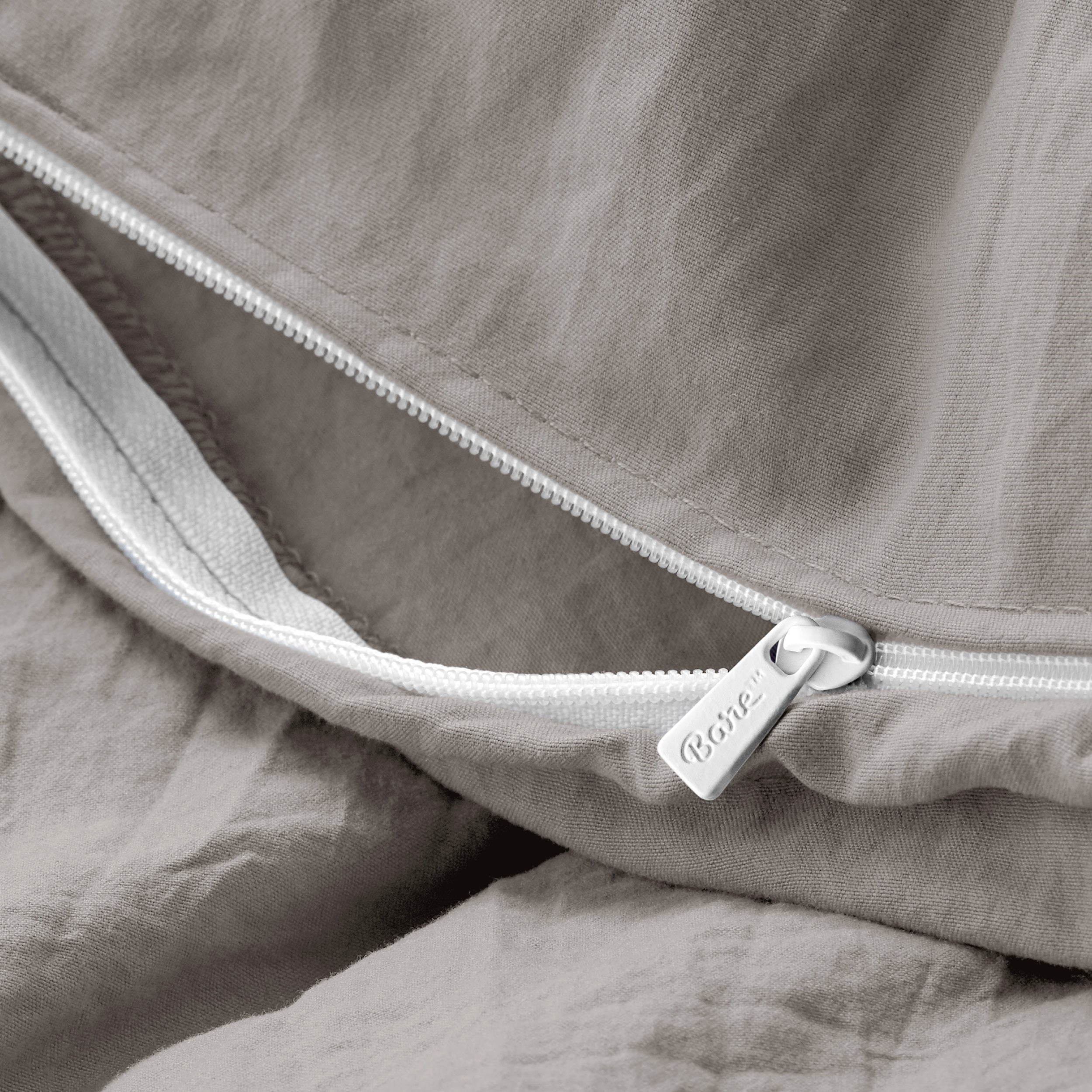 Close up of the zipper on the duvet cover partially opened