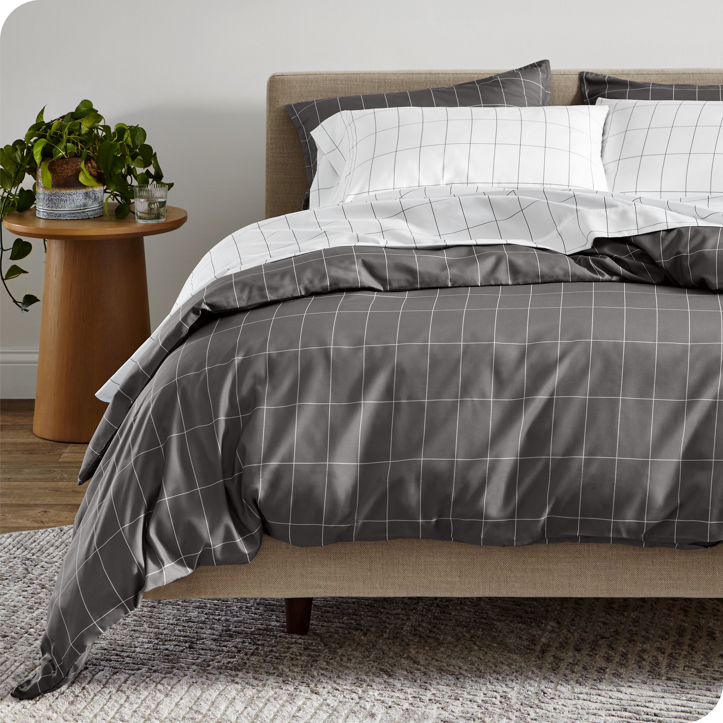 A modern bed with a grid comforter duvet set