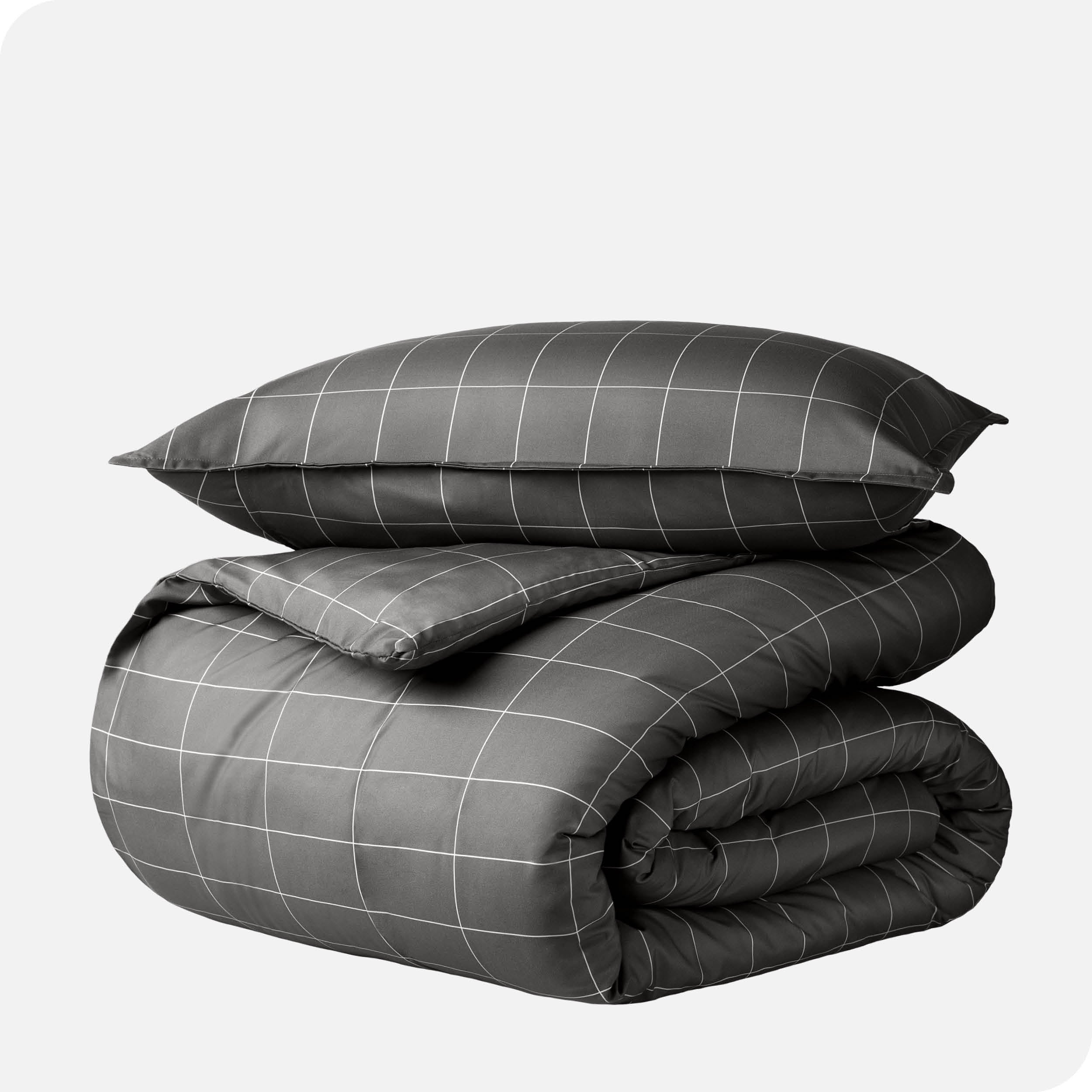 A duvet cover set folded and stacked.