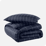 A duvet cover set folded and stacked.