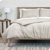 A modern bed with a grid comforter duvet set