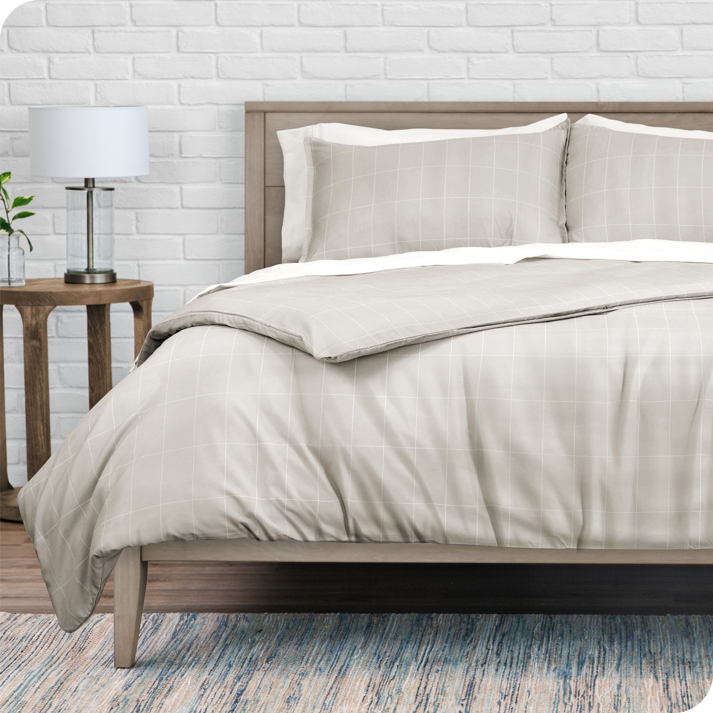 A modern bed with a grid comforter duvet set