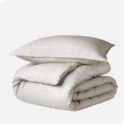 A duvet cover set folded and stacked.