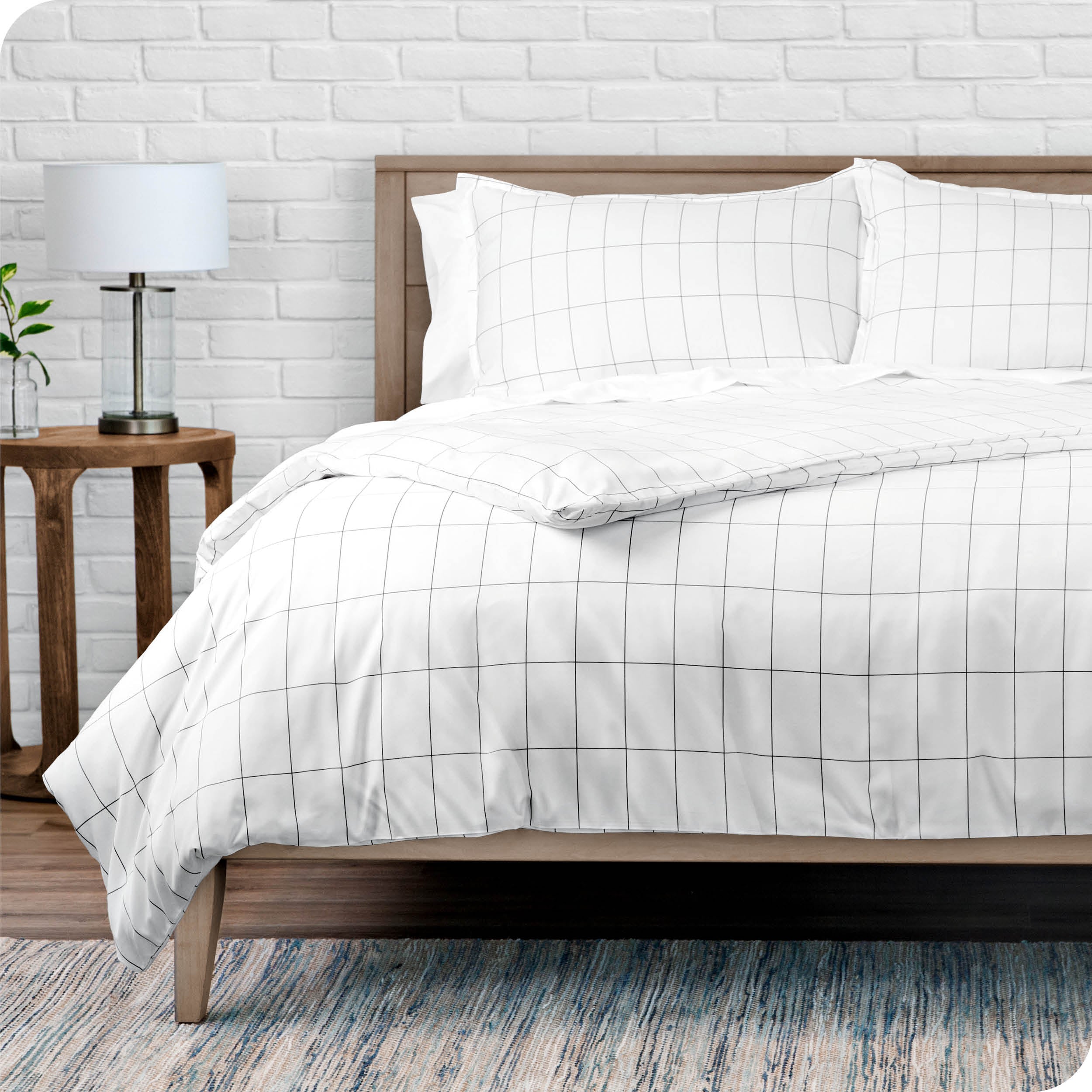 A modern bed with a grid comforter duvet set
