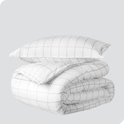 A duvet cover set folded and stacked.