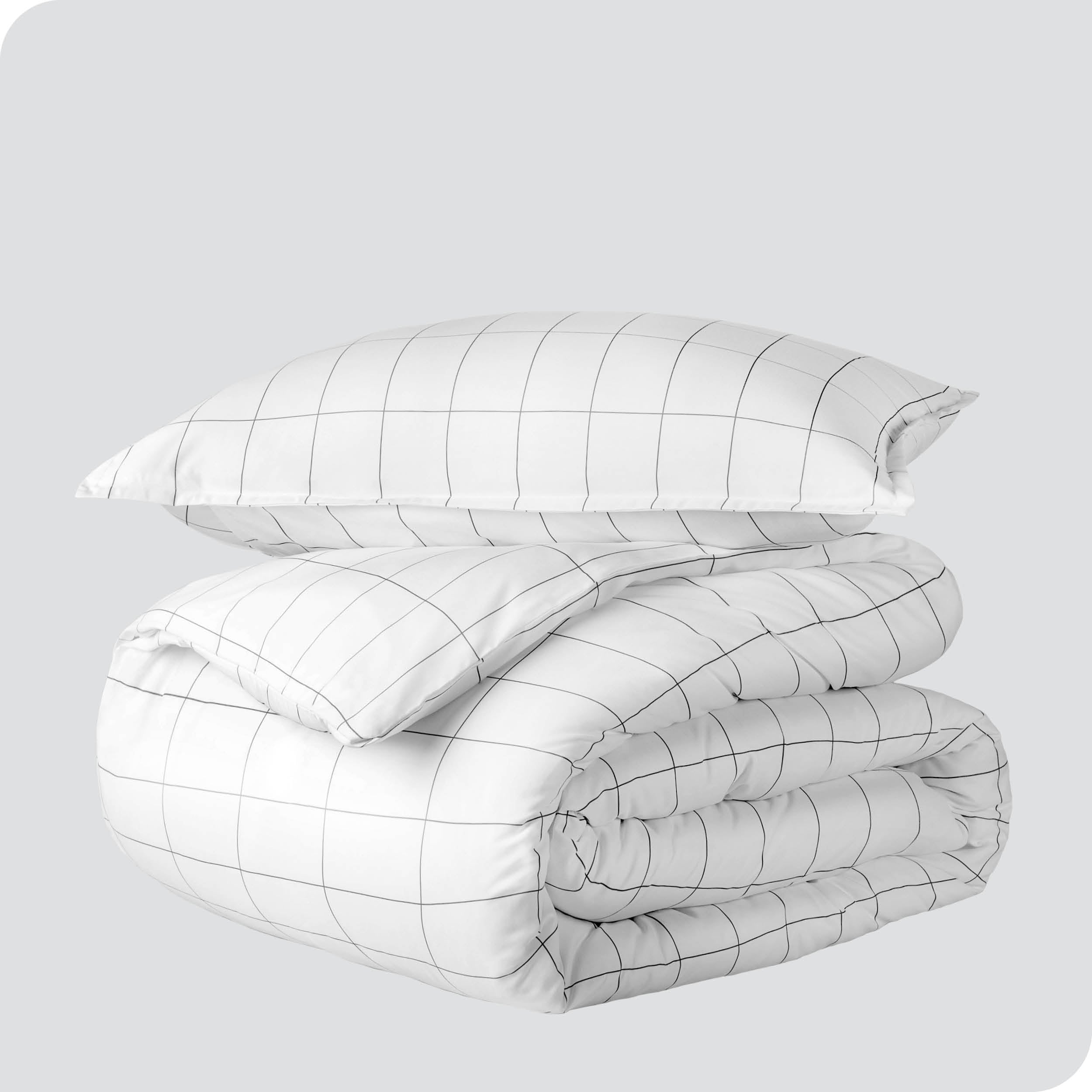 A duvet cover set folded and stacked.