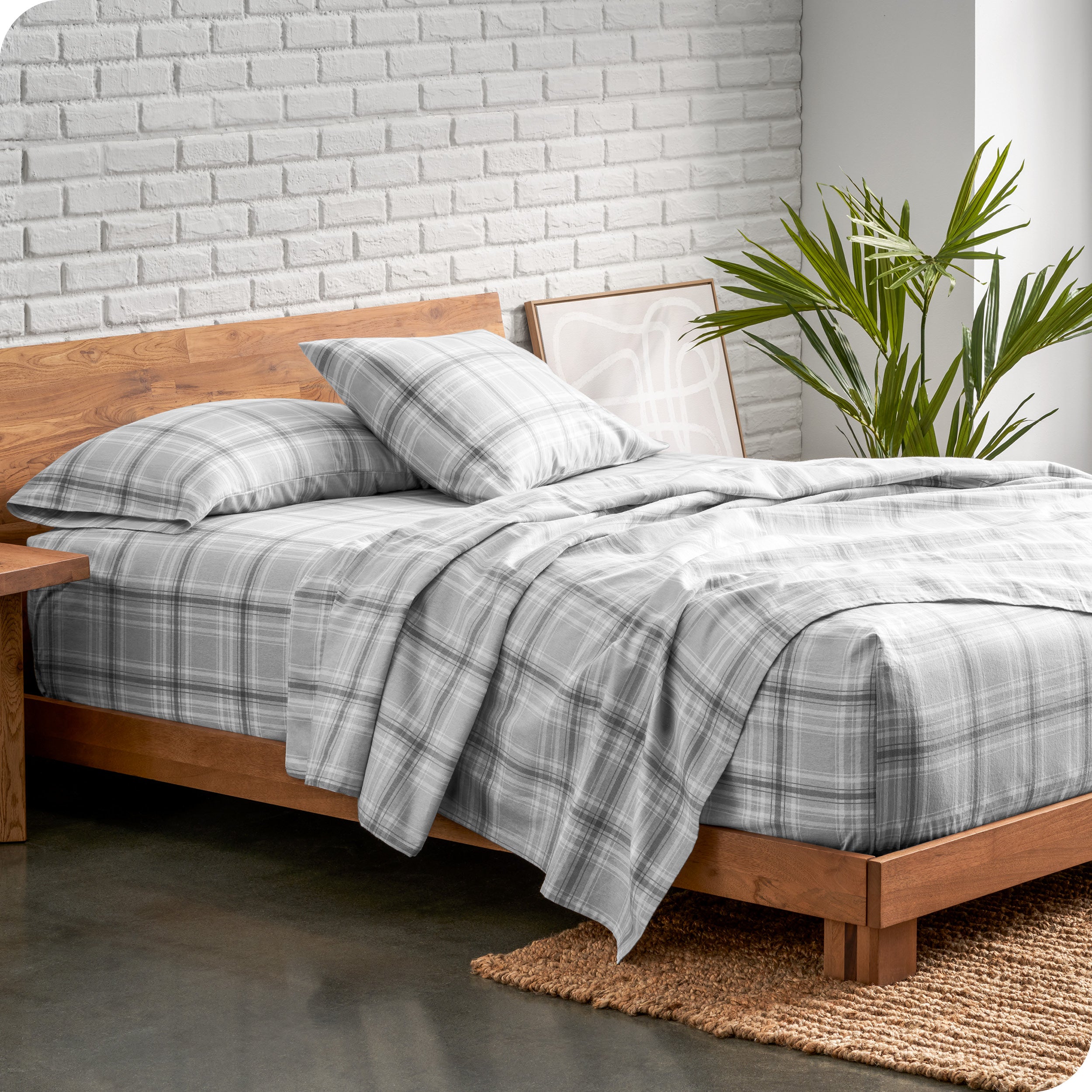 Plaid flannel sheets on a bed