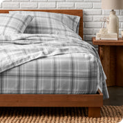 A bed made with cotton flannel sheets
