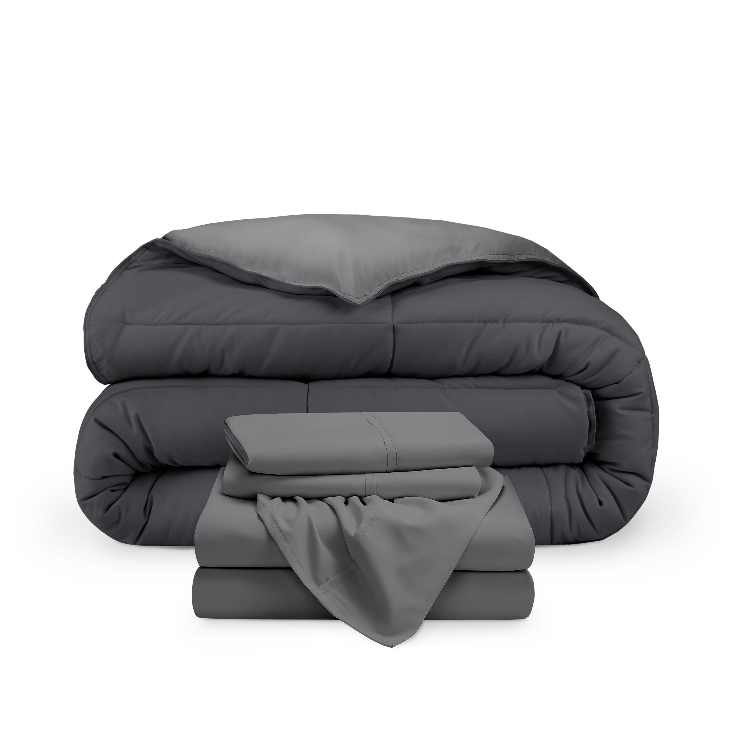 A reversible microfiber comforter and a coordinating sheet set folded and stacked