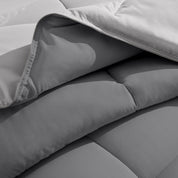 Close up of the reversible comforter showing the box stitching and the two colors