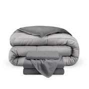 A reversible microfiber comforter and a coordinating sheet set folded and stacked