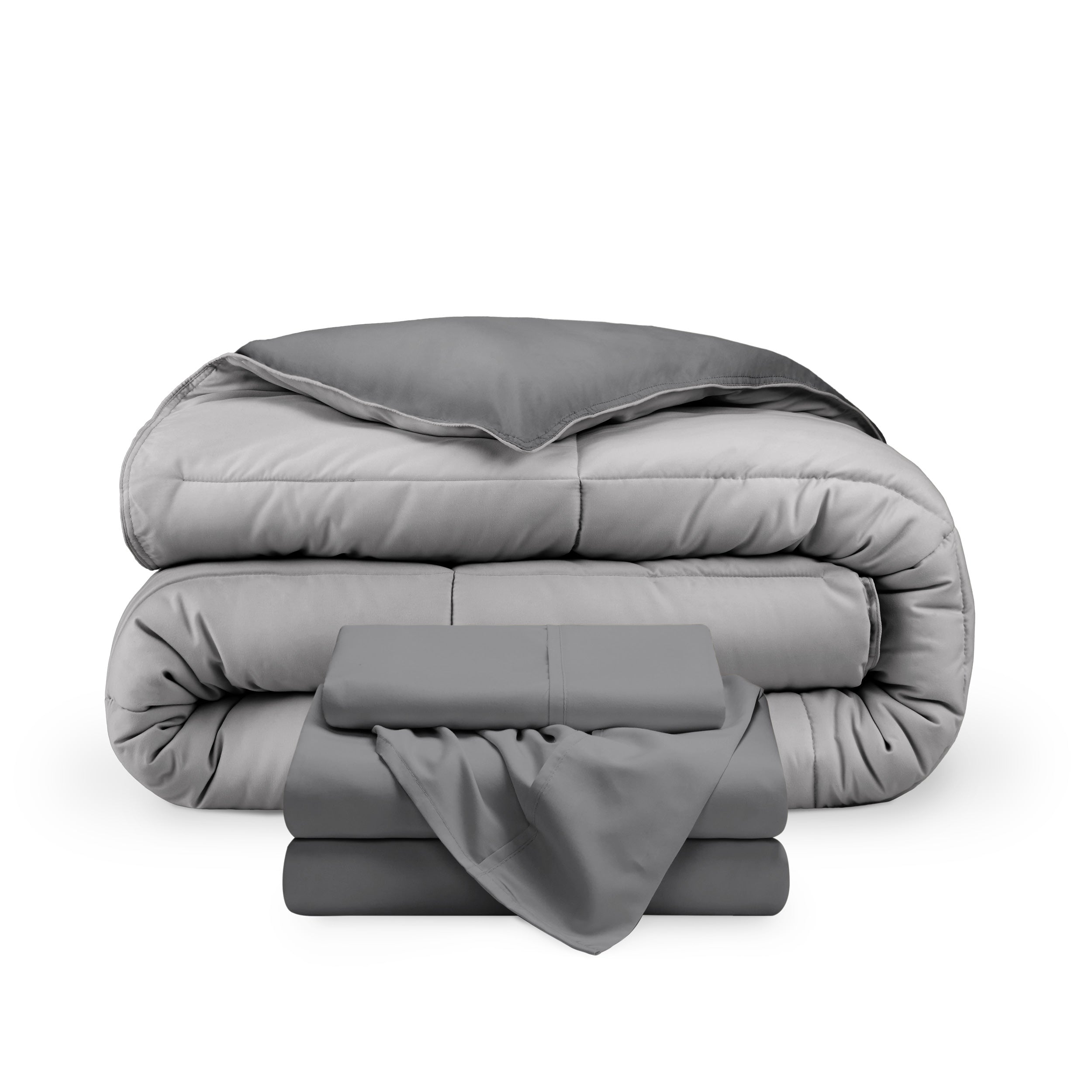 A reversible microfiber comforter and a coordinating sheet set folded and stacked