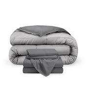 A reversible microfiber comforter and a coordinating sheet set folded and stacked