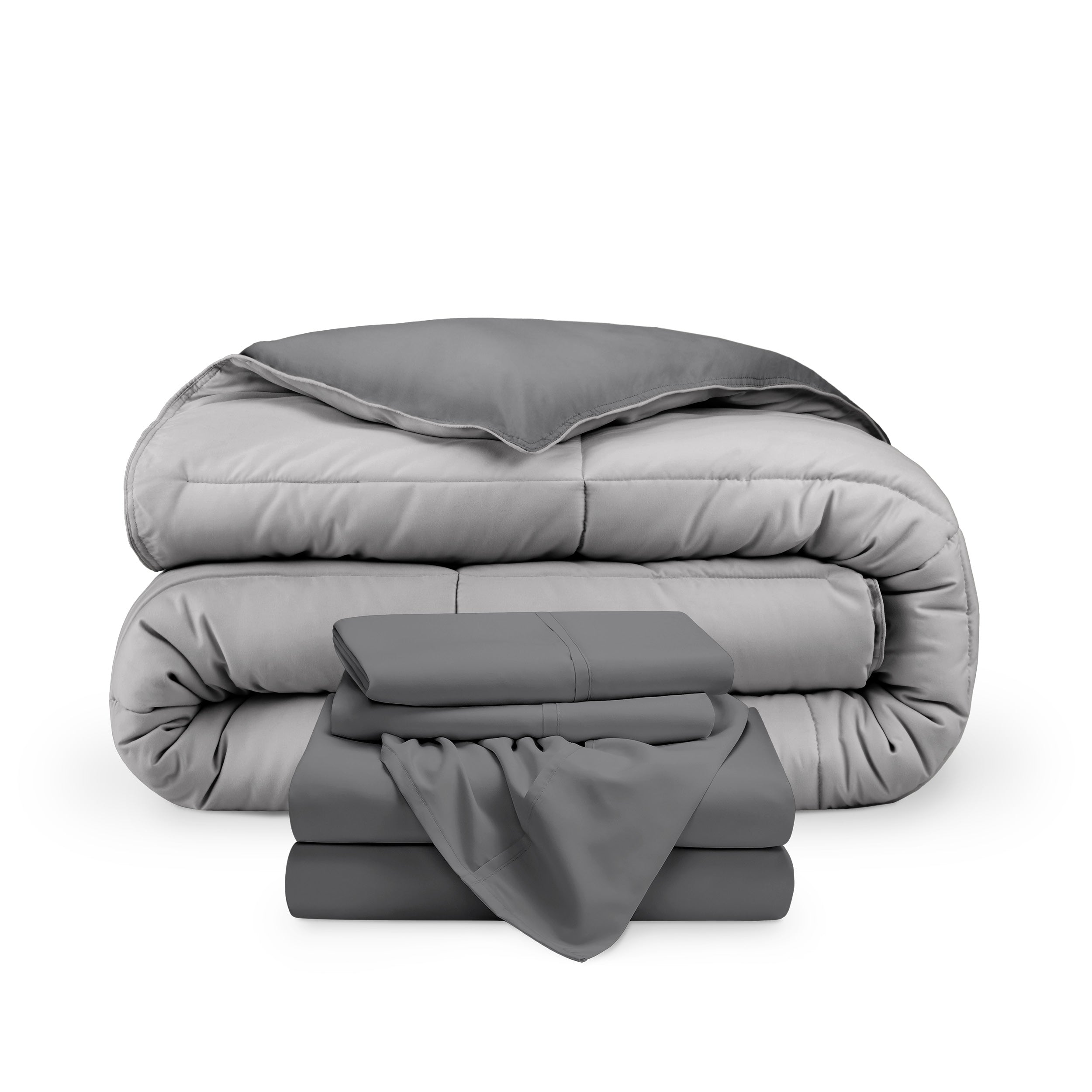 A reversible microfiber comforter and a coordinating sheet set folded and stacked