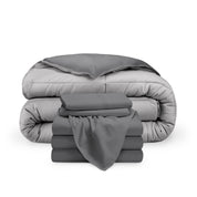 A reversible microfiber comforter and a coordinating sheet set folded and stacked