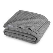 A cotton waffle blanket folded