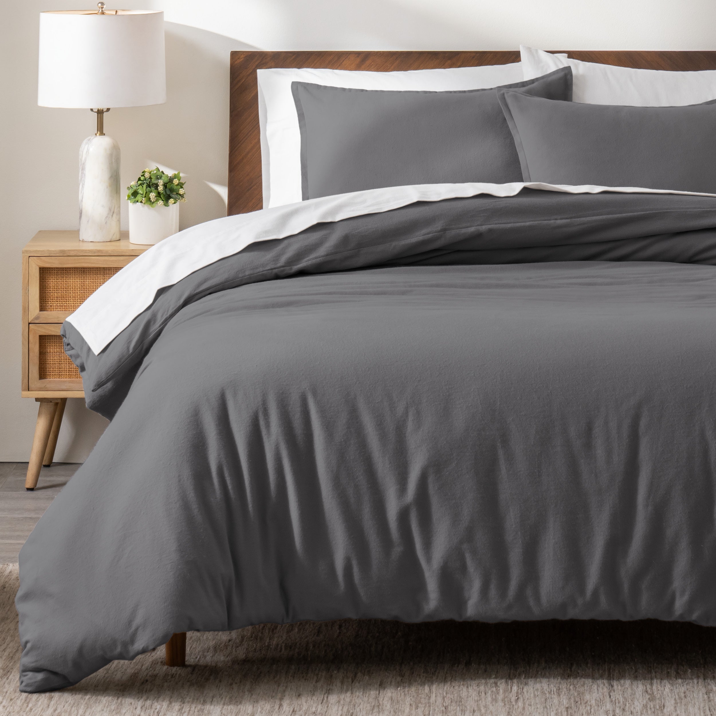 A modern bed with a flannel duvet cover set consisting of the duvet cover and two pillows.