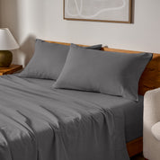 A bed made with matching flannel sheets and pillowcases