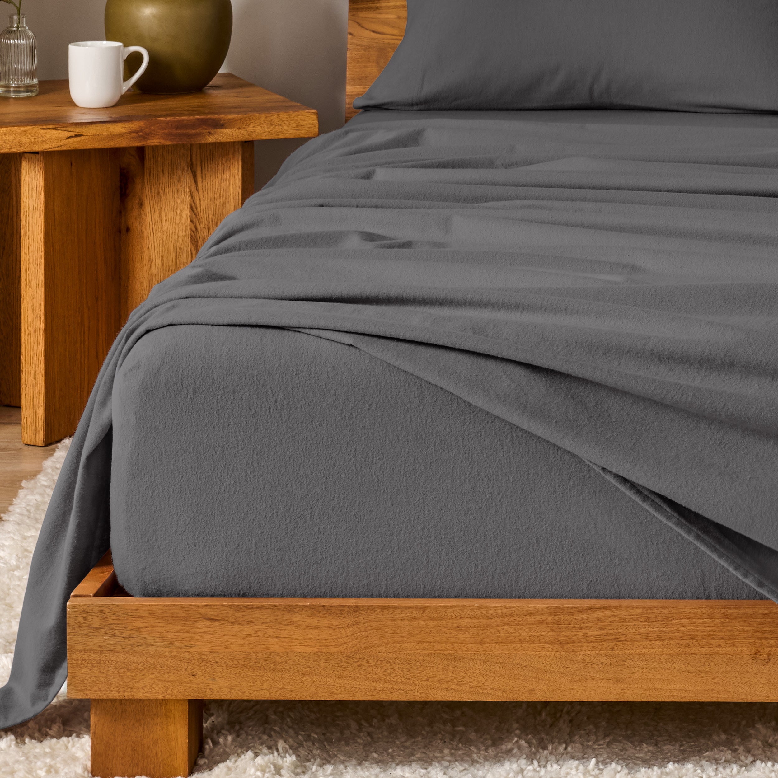 A modern bedroom with cotton flannel sheets on the bed