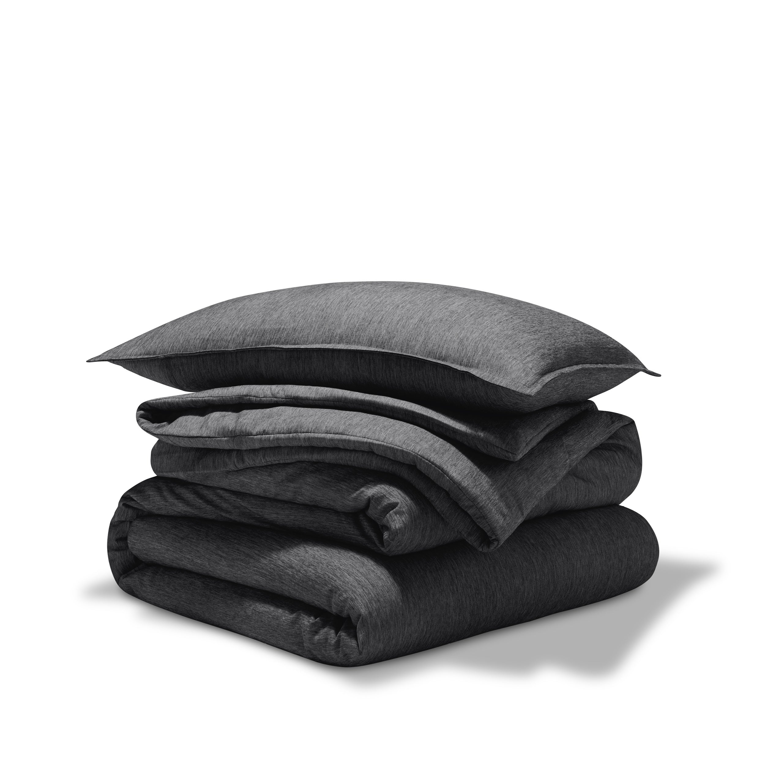 A comforter folded with a matching pillow sham stacked on top
