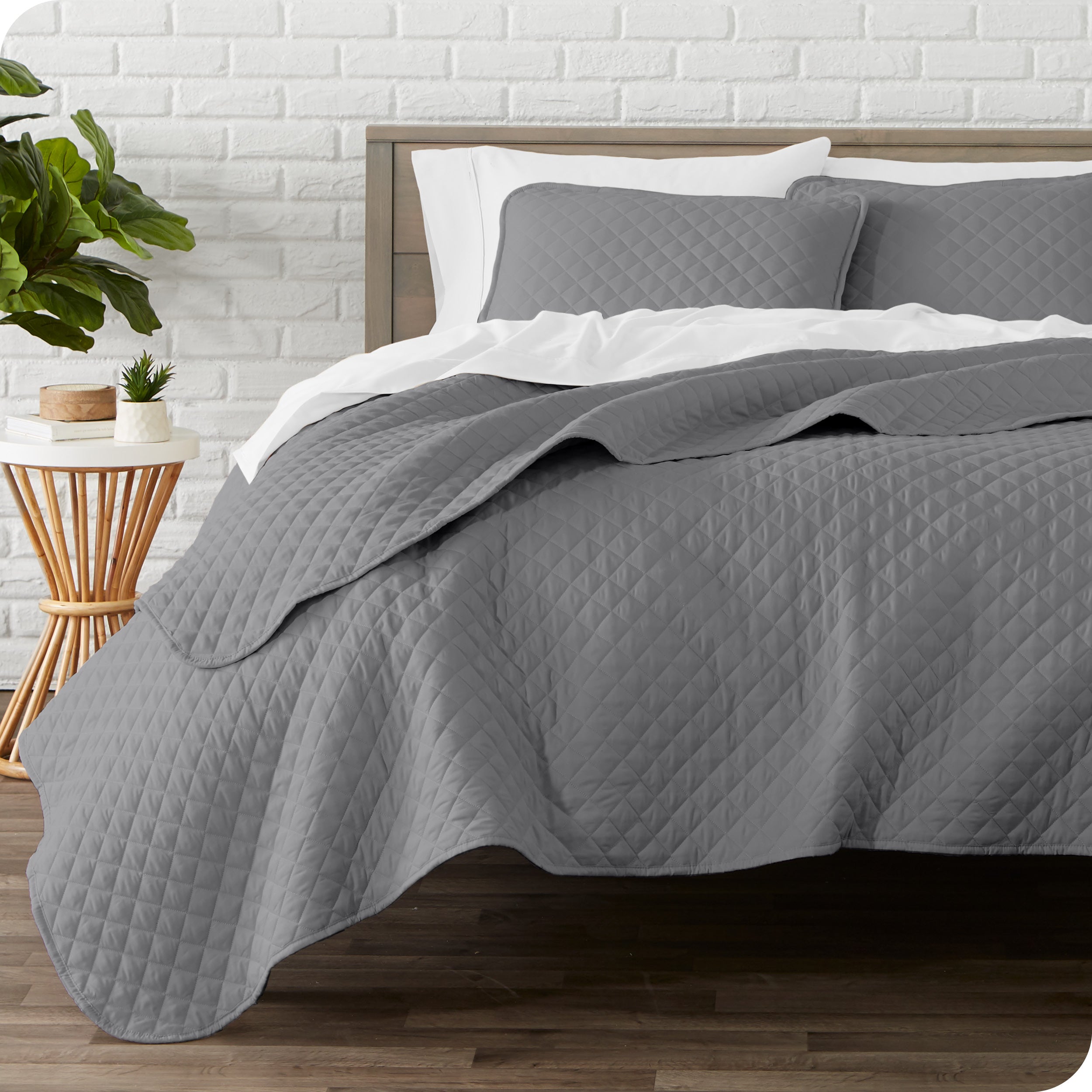 A quilted coverlet set on a bed