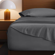 A cozy bedroom with a bed covered in soft microfiber sheets