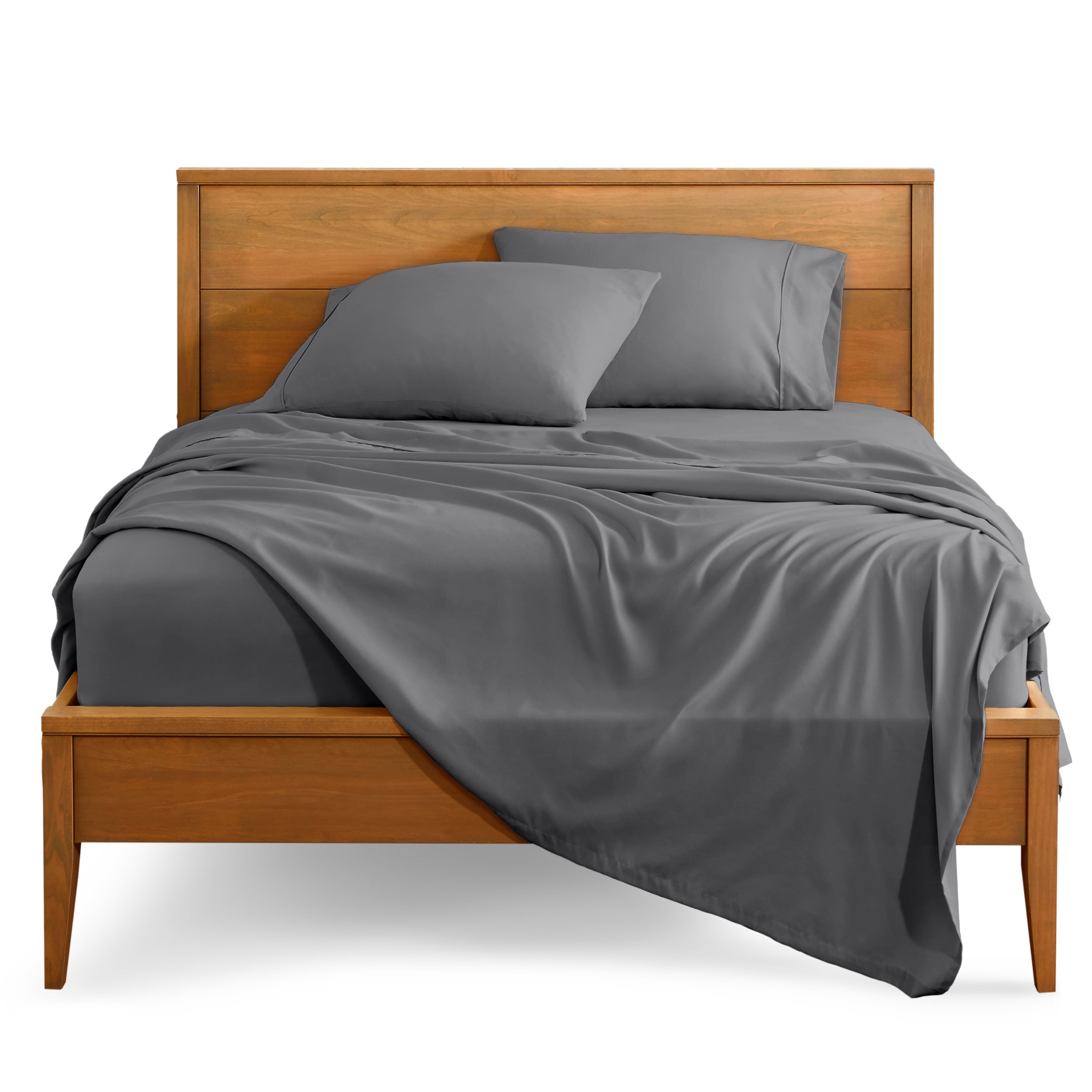 Microfiber sheet set on a bed with a wooden bed frame