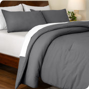 A side view of a bed made with a track stitch comforter set