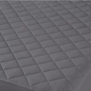 Close up of a quilted mattress pad
