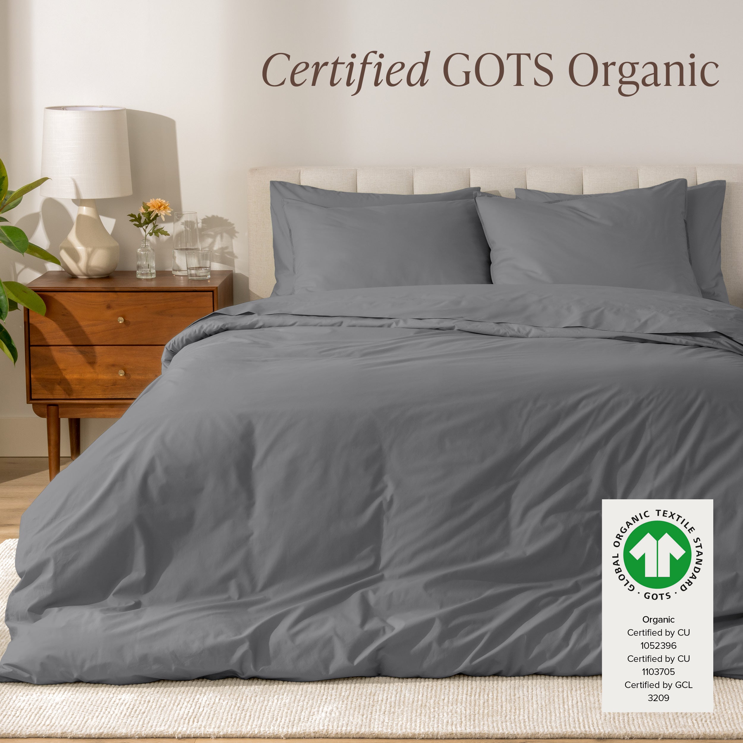 A modern bed with a organic cotton percale duvet cover on, it's Certified GOTS Organic.