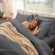 A women sleep on the bed with organic cotton percale duvet cover and pillowcases.