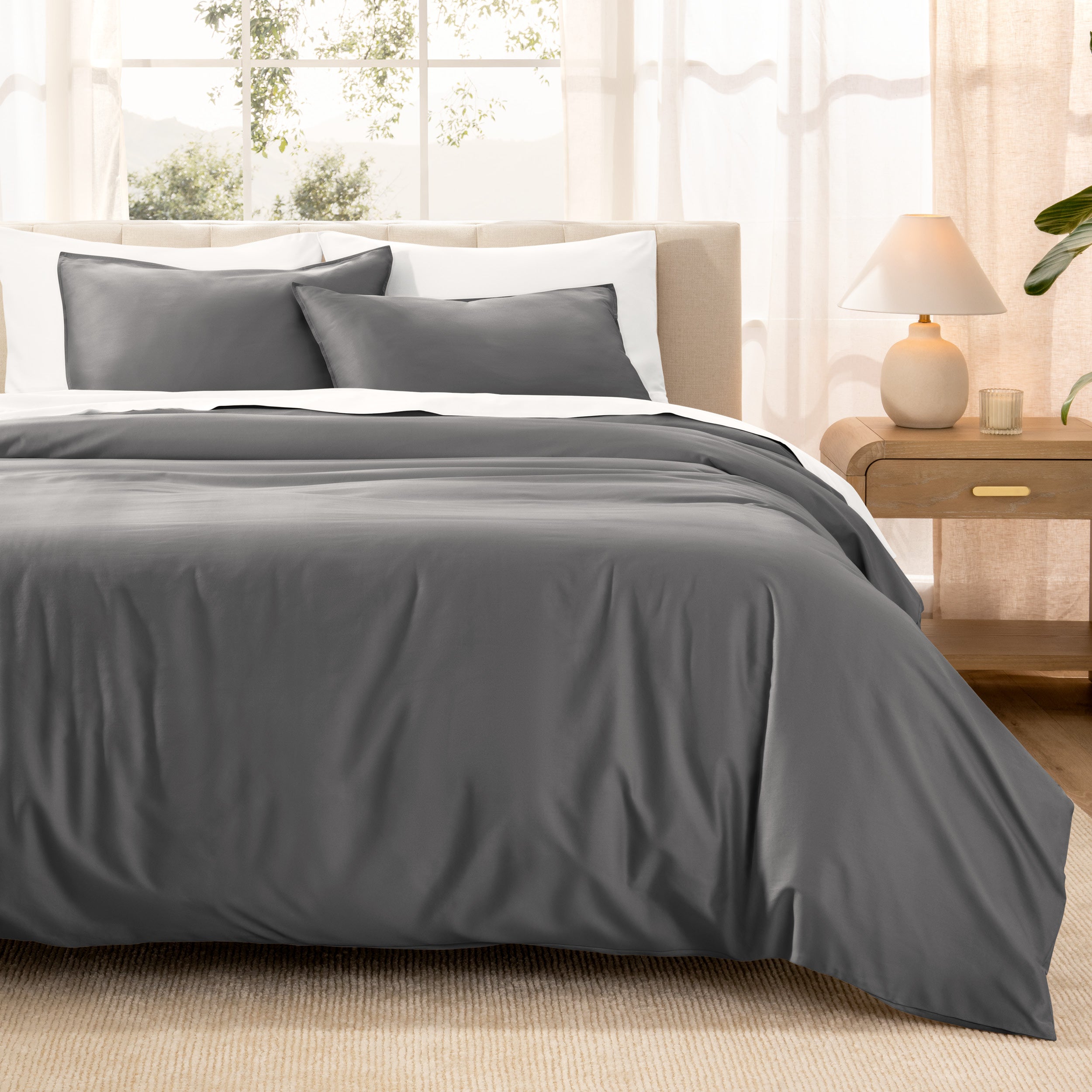 Warm bright room scene showing Sateen Duvet Set  laid out over the bed