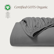 A single certified GOTS organic cotton fitted sheet folded