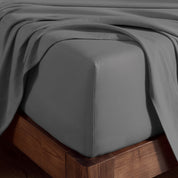 A corner of bed with fitted sheet to show the deep pocket feature and the texture.