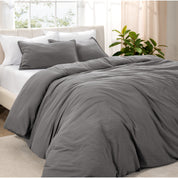 Angled view of bed with a duvet cover folded over on itself