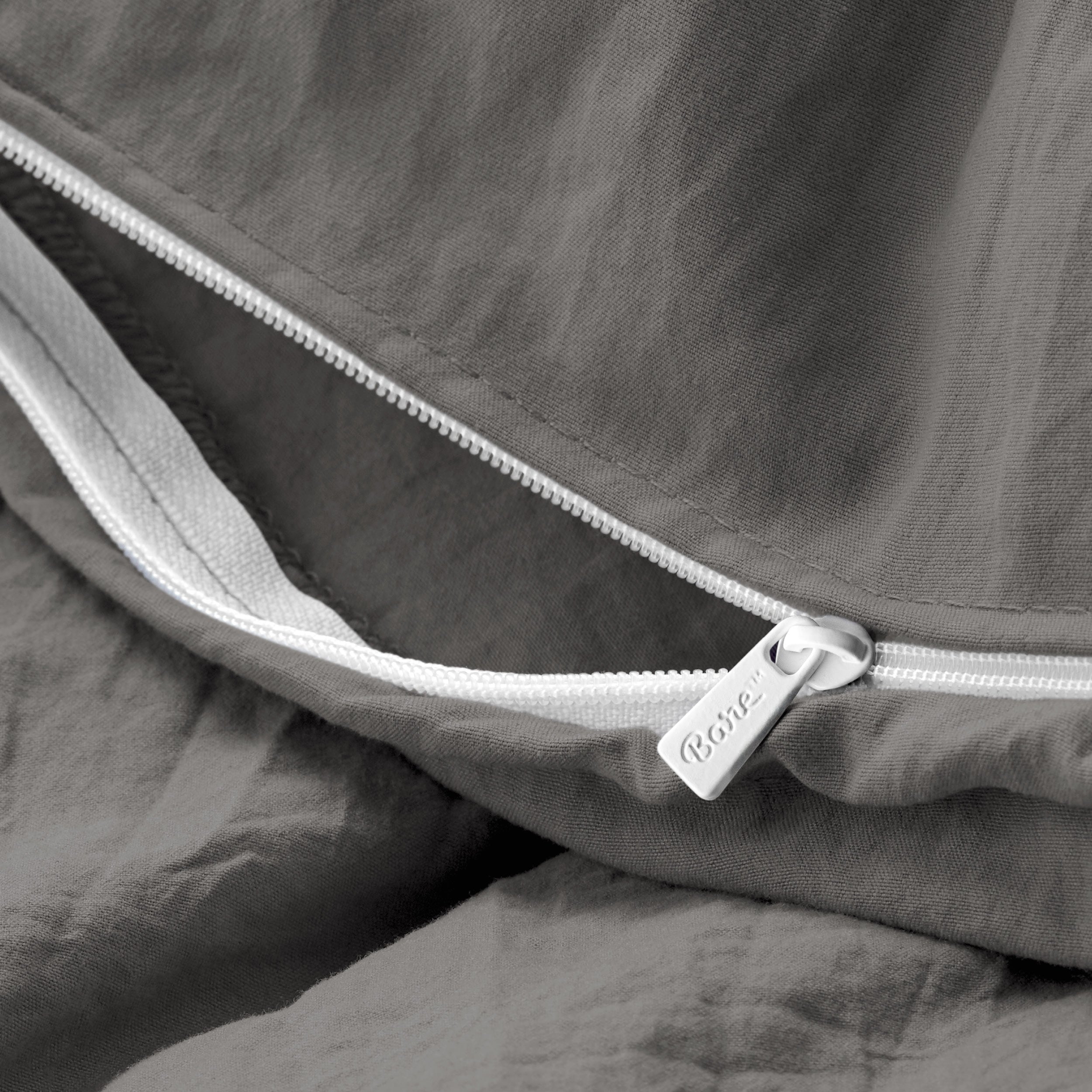 Close up of the zipper on the duvet cover partially opened
