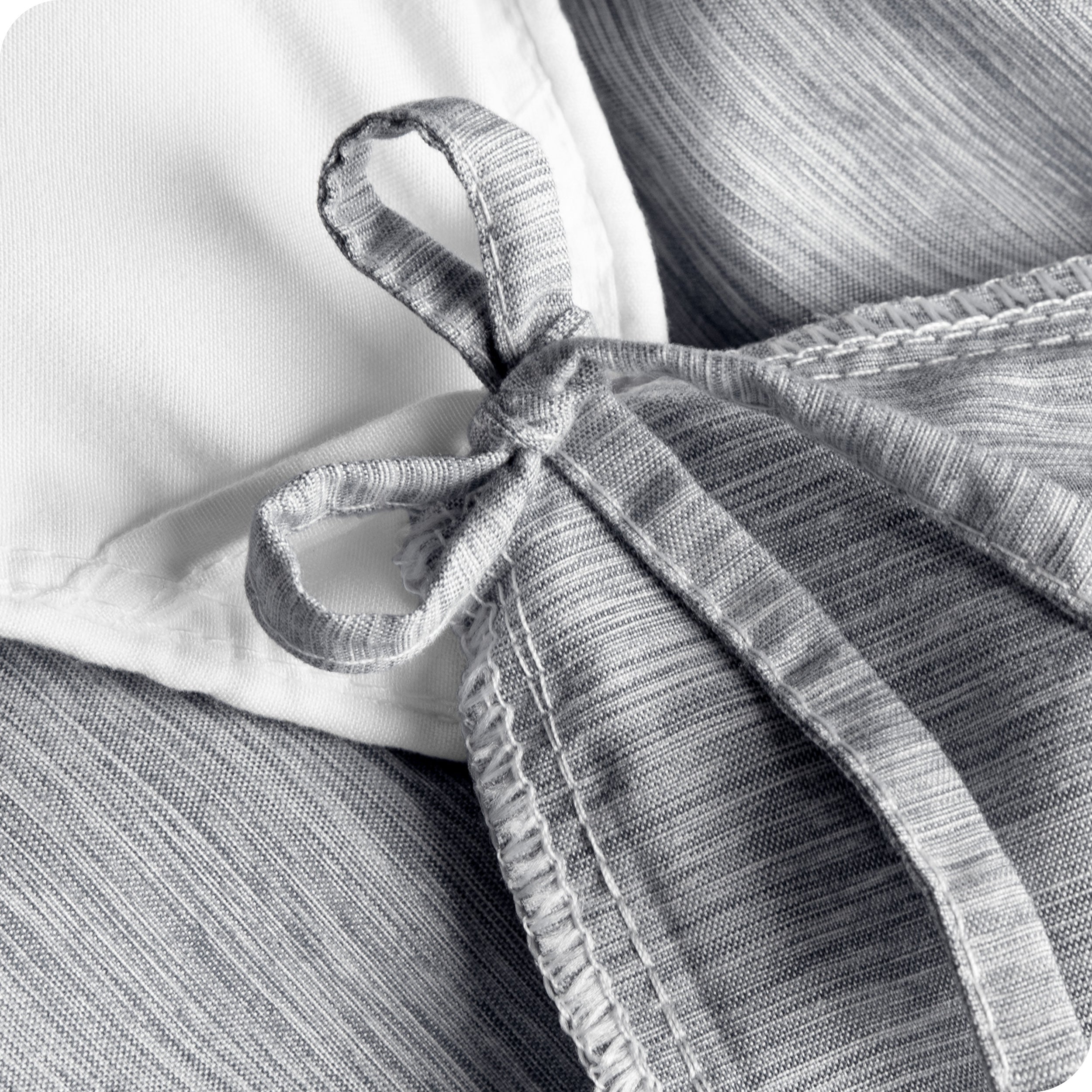 Close up of the cloth tie straps used to secure the duvet cover to the insert
