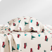 A flannel pillowcase on a pillow set on a bed with matching sheets