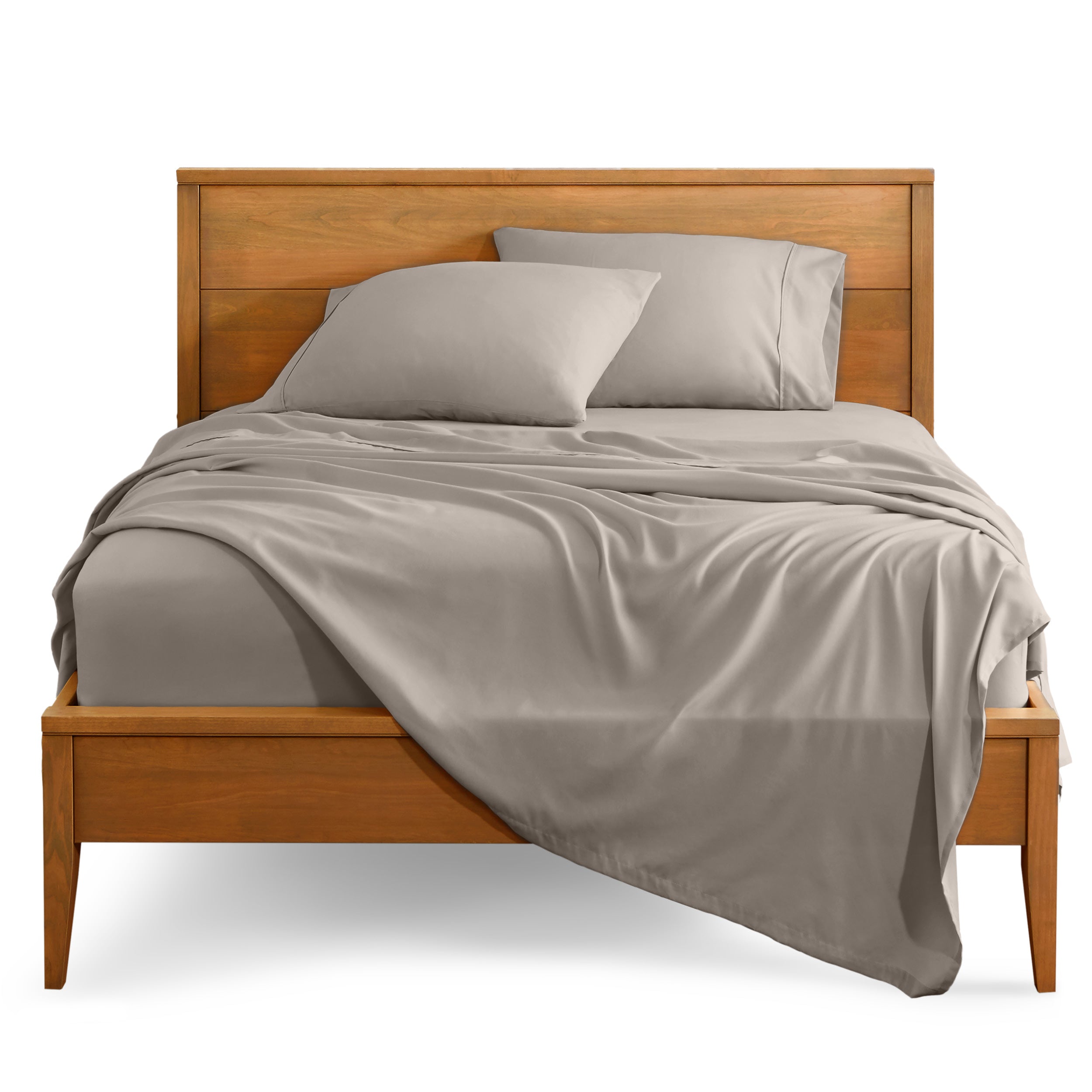 Microfiber sheet set on a bed with a wooden bed frame