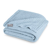 A cotton waffle blanket folded