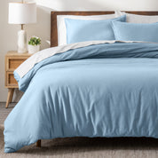 A modern bed with a flannel duvet cover set consisting of the duvet cover and two pillows.