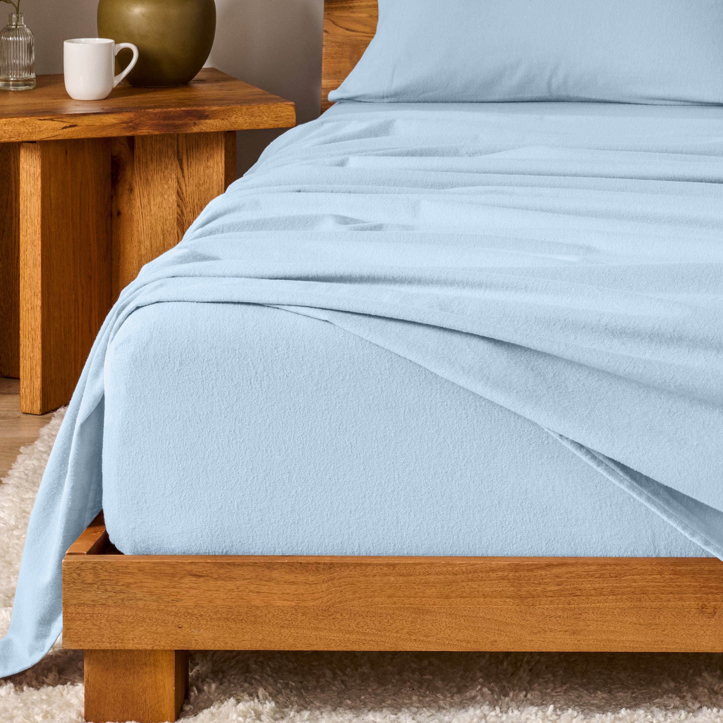 A modern bedroom with cotton flannel sheets on the bed