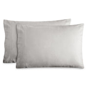 2 pillows with flannel pillowcases on them