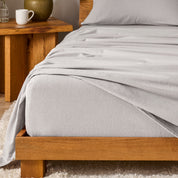 A modern bedroom with cotton flannel sheets on the bed