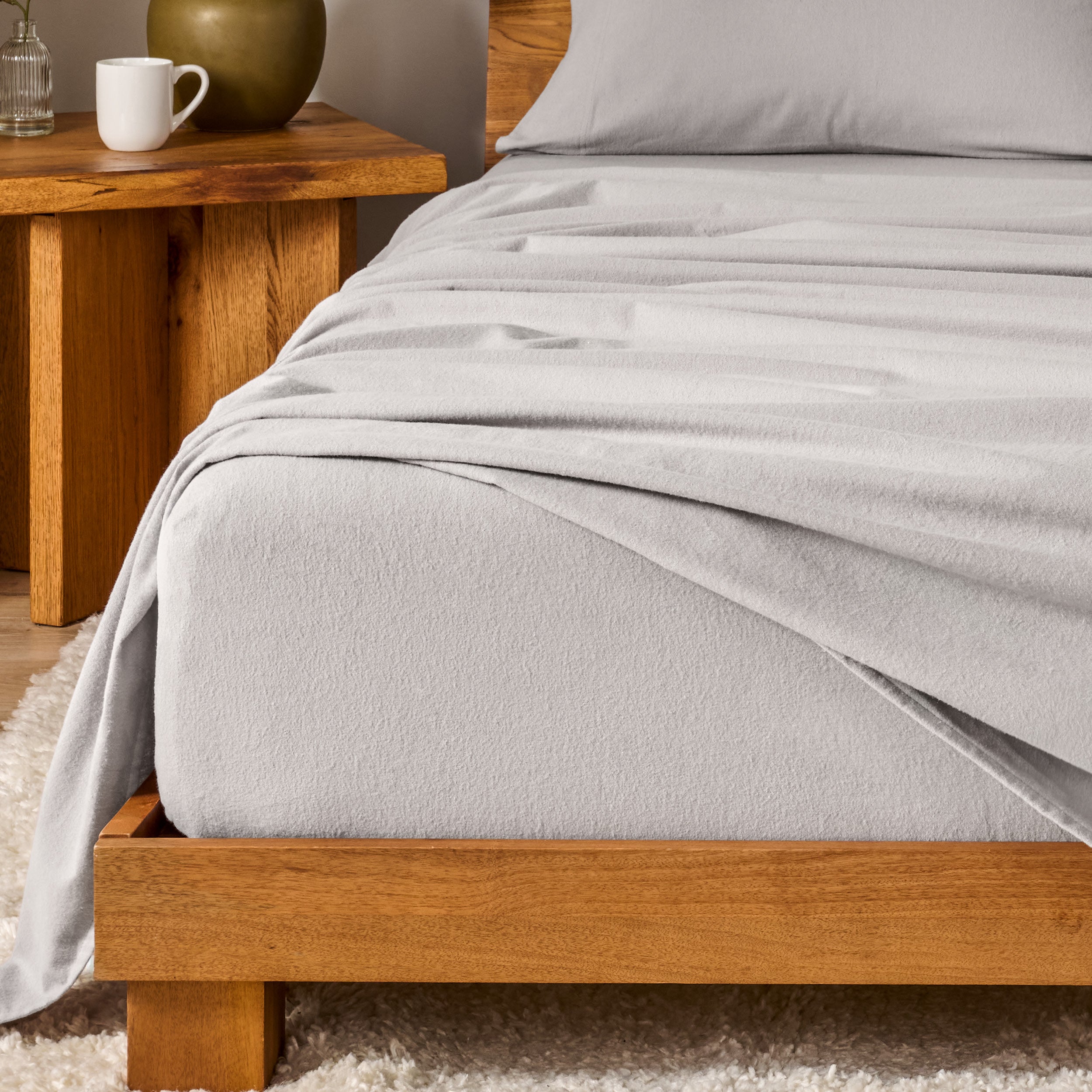 A modern bedroom with cotton flannel sheets on the bed