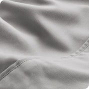Close-up of the fabric and its neatly finished edge.