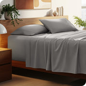 A cozy bedroom featuring a neatly made bed with soft, microfiber sheets